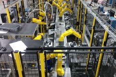 AST-SuperTrak-and-Fanuc-robot-based-assembly-cell-upper-end-line-view